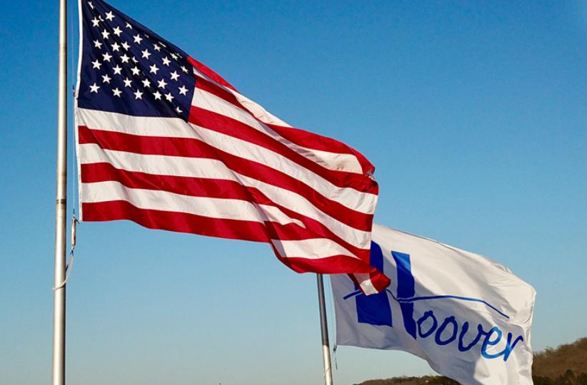 The Hoover AL flag and the American flag fly over the Hoover AL Municipal Court building.